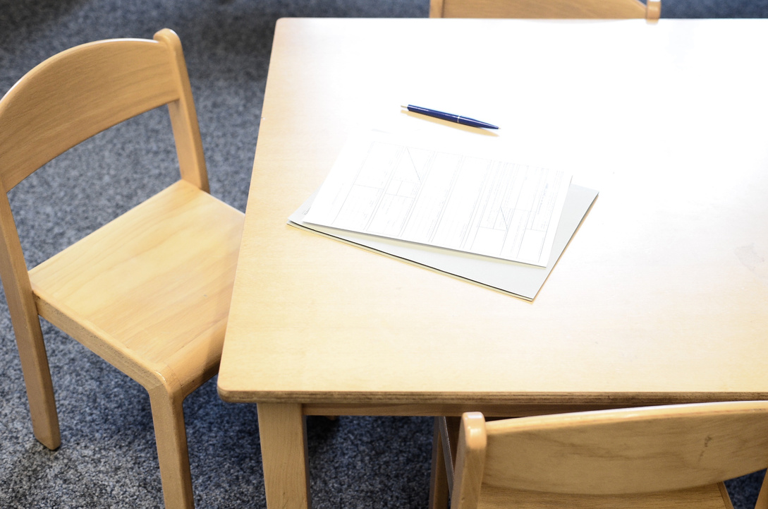 Application sheet with pen on table in building