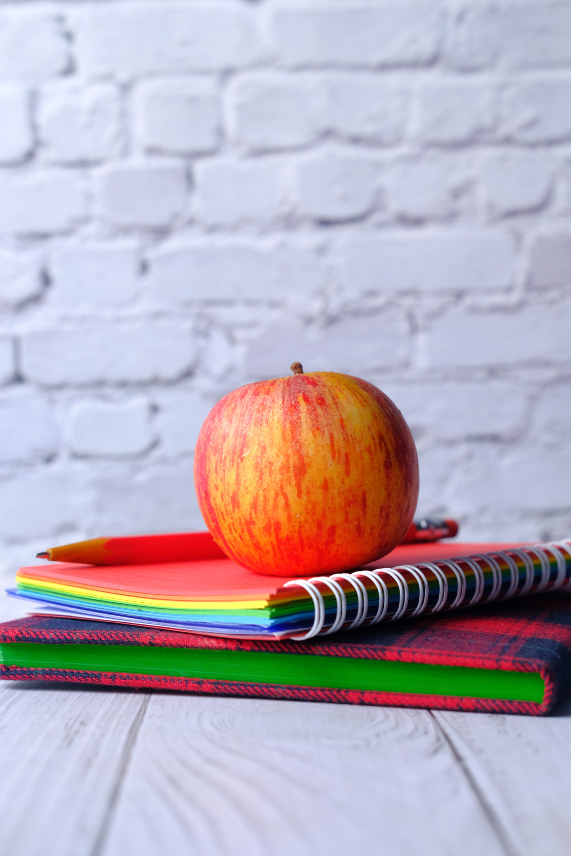 Apple and Notepad on Table, Back to School Concept